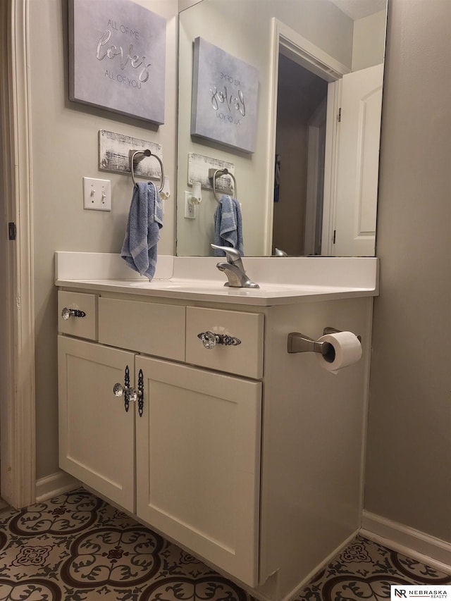 16228 Virginia St, Omaha, NE 68136 - bathroom featuring tile patterned flooring, vanity, and baseboards