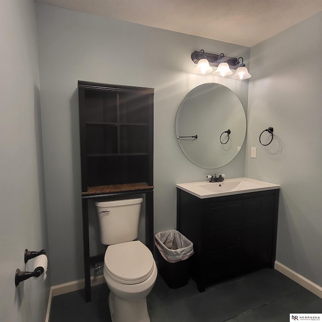 16228 Virginia St, Omaha, NE 68136 - bathroom featuring vanity, toilet, and baseboards