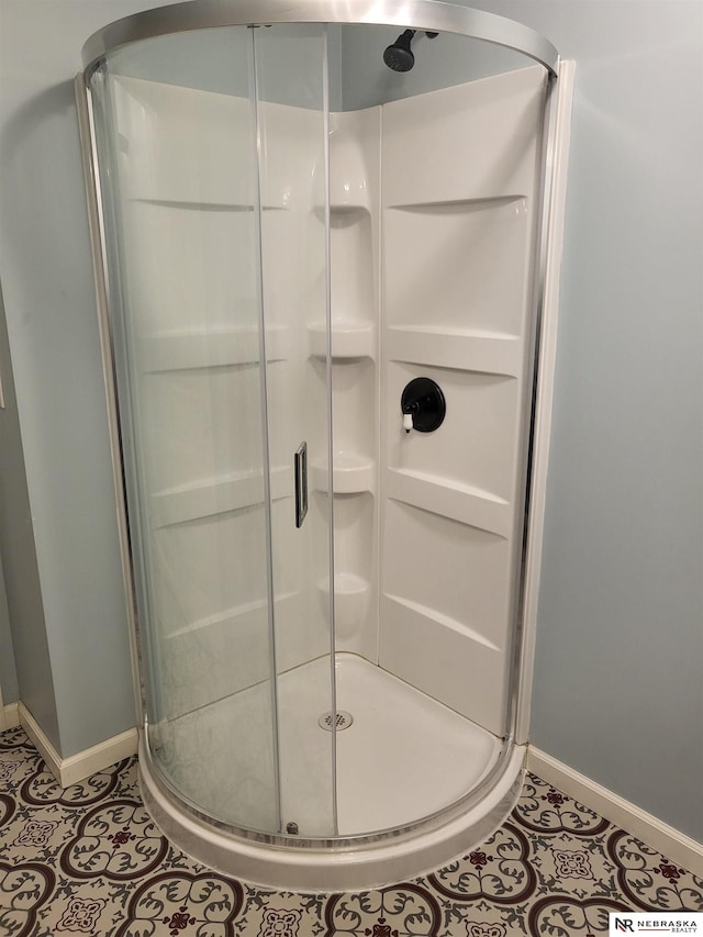16228 Virginia St, Omaha, NE 68136 - full bathroom with baseboards, a stall shower, and tile patterned floors