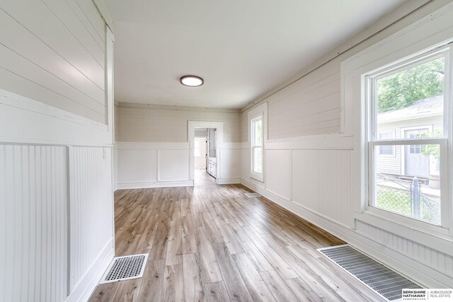 1943 Washington St, Blair, NE 68008 - spare room featuring a decorative wall and light wood-style flooring