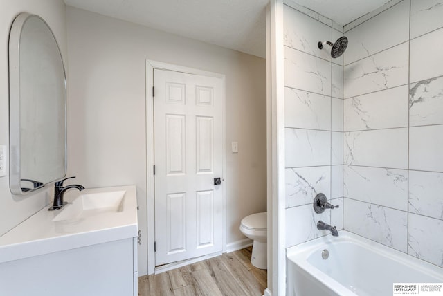 1943 Washington St, Blair, NE 68008 - full bath with toilet, vanity, wood finished floors, and shower / bath combination