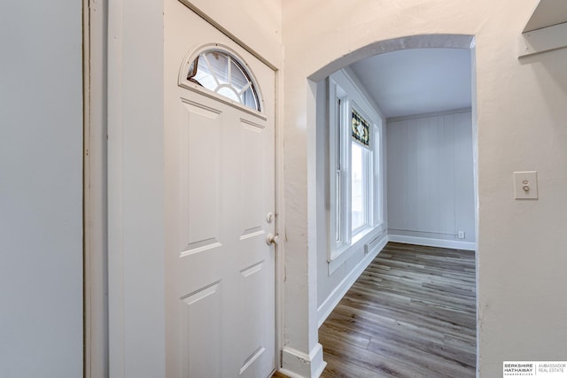 1943 Washington St, Blair, NE 68008 - foyer with arched walkways, baseboards, and wood finished floors