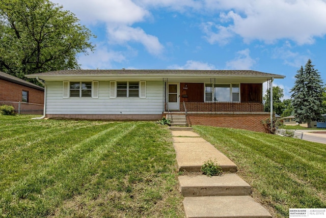 5002 S 77th Ave, Ralston, NE 68127 - view of front of home featuring a front lawn and a porch