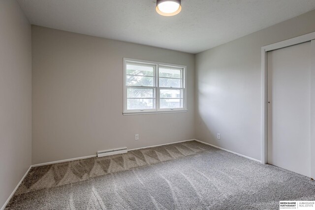 5002 S 77th Ave, Ralston, NE 68127 - carpeted empty room with baseboard heating and baseboards