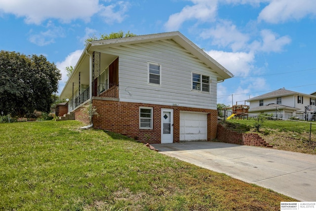 5002 S 77th Ave, Ralston, NE 68127 - view of front facade featuring brick siding, an attached garage, and driveway