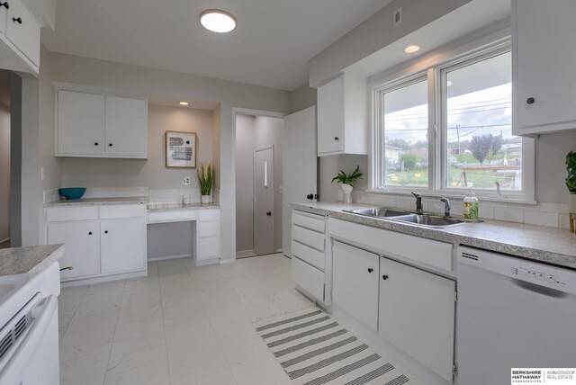 5002 S 77th Ave, Ralston, NE 68127 - kitchen with dishwasher, a sink, white cabinetry, light countertops, and decorative backsplash