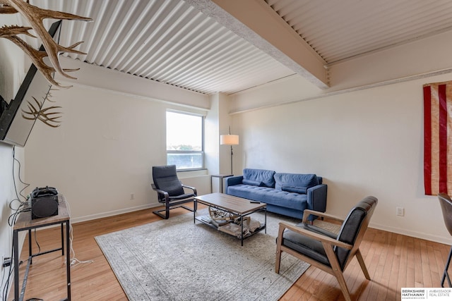 105 N 31st Ave Unit 502, Omaha, NE 68131 - living area with hardwood / wood-style floors, baseboards, and beam ceiling