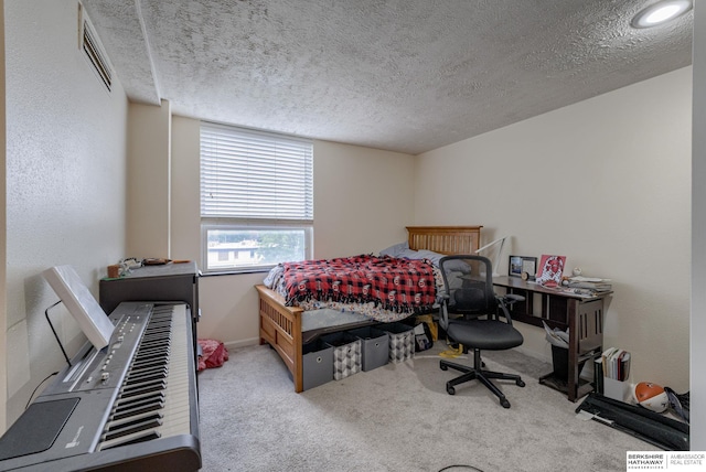105 N 31st Ave Unit 502, Omaha, NE 68131 - bedroom featuring a textured ceiling, carpet flooring, and baseboards