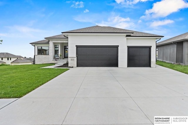 10317 S 191st Ave, Omaha, NE 68136 - prairie-style home with an attached garage, driveway, a front yard, and roof with shingles