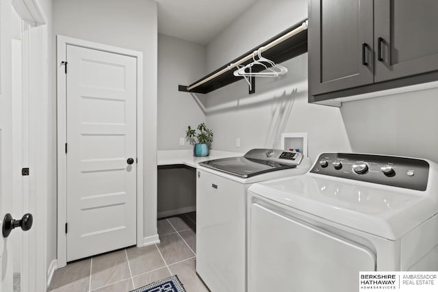 10317 S 191st Ave, Omaha, NE 68136 - laundry area featuring cabinet space, light tile patterned floors, and washing machine and clothes dryer