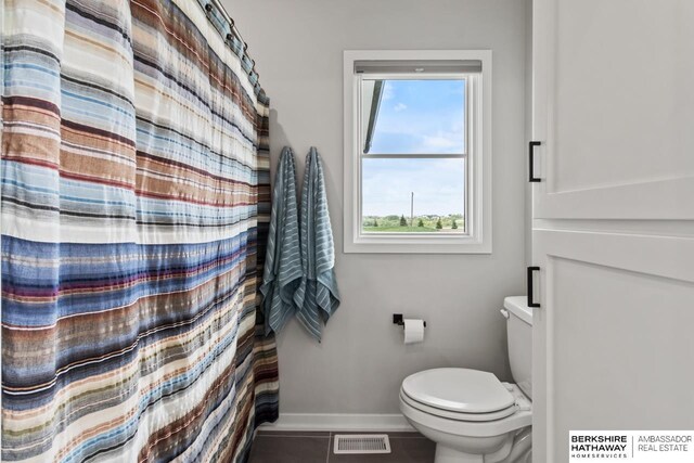 10317 S 191st Ave, Omaha, NE 68136 - full bathroom with toilet, baseboards, and tile patterned flooring
