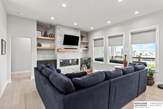 10317 S 191st Ave, Omaha, NE 68136 - living area with light wood-style flooring, a fireplace, recessed lighting, and baseboards
