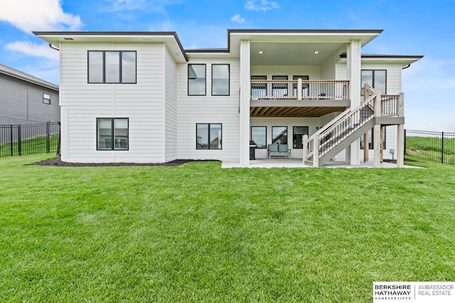 10317 S 191st Ave, Omaha, NE 68136 - back of property featuring a patio, stairs, and a deck