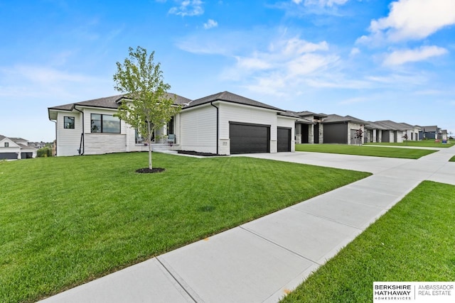 10317 S 191st Ave, Omaha, NE 68136 - view of front facade with a garage, a front yard, driveway, and a residential view