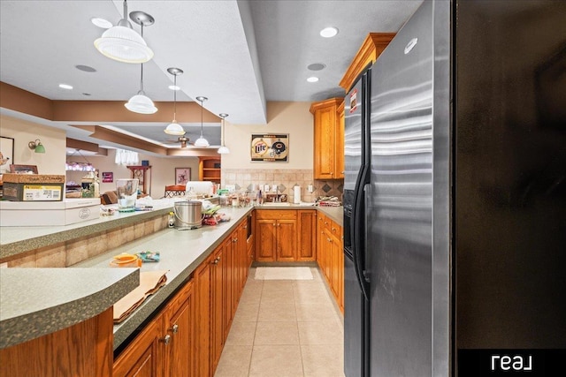 15102 Boyd St, Omaha, NE 68116 - kitchen with stainless steel fridge, backsplash, brown cabinets, decorative light fixtures, and a sink