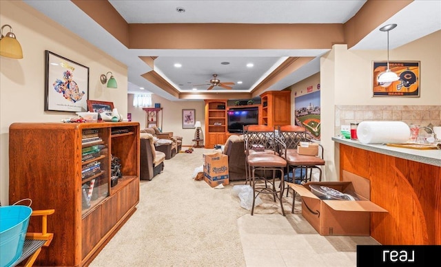 15102 Boyd St, Omaha, NE 68116 - living area with a ceiling fan, light colored carpet, recessed lighting, and a raised ceiling