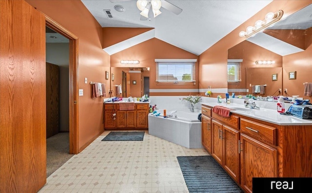 15102 Boyd St, Omaha, NE 68116 - bathroom featuring ceiling fan, vanity, a garden tub, and vaulted ceiling