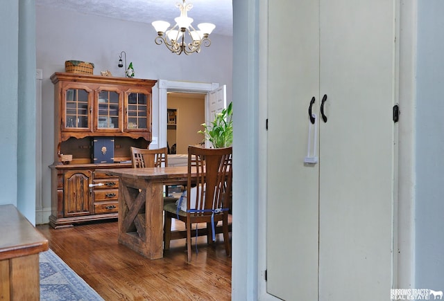 429 N 4th St, Tecumseh, NE 68450 - dining area featuring a chandelier and dark wood-style flooring