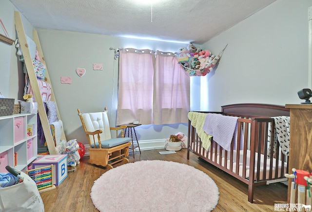 429 N 4th St, Tecumseh, NE 68450 - bedroom featuring wood finished floors and a textured ceiling