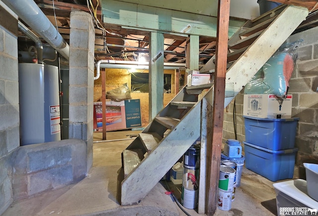 429 N 4th St, Tecumseh, NE 68450 - unfinished basement featuring water heater and concrete block wall