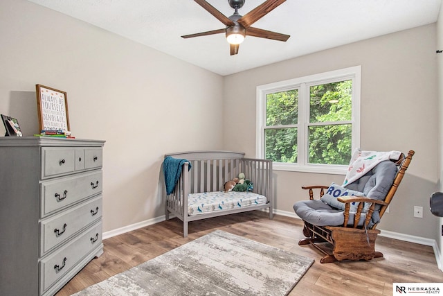 606 Pioneer Dr, Fort Calhoun, NE 68023 - bedroom featuring baseboards, light wood finished floors, and a ceiling fan