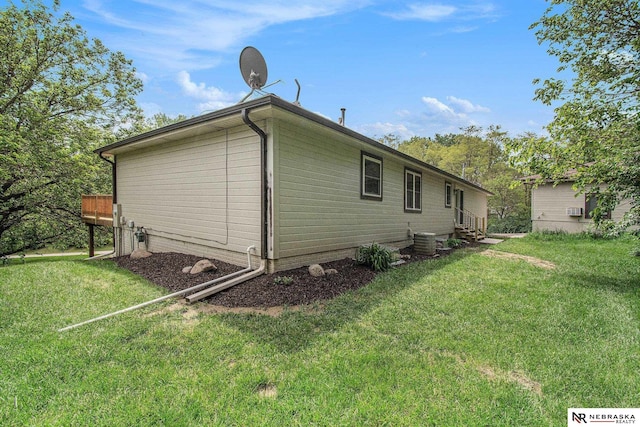 606 Pioneer Dr, Fort Calhoun, NE 68023 - view of home's exterior featuring a lawn and central AC