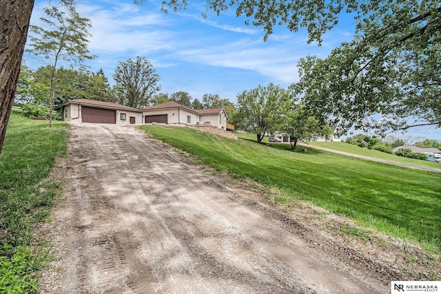 606 Pioneer Dr, Fort Calhoun, NE 68023 - view of front of home with driveway and a front yard