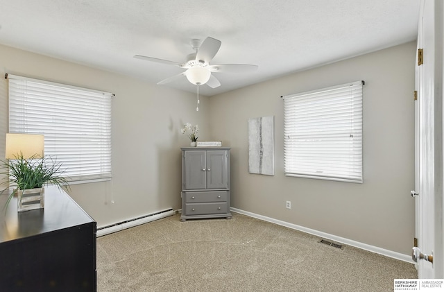 6641 S 85th St, Ralston, NE 68127 - carpeted bedroom with a baseboard radiator, a ceiling fan, and baseboards
