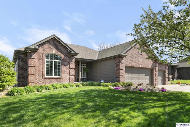 1346 Fairway Cir, Ashland, NE 68003 - view of front of home featuring brick siding, an attached garage, a front lawn, and concrete driveway