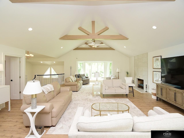 20640 Rawhide Rd, Omaha, NE 68022 - living area featuring light wood-style flooring, a tile fireplace, ceiling fan, a chandelier, and recessed lighting