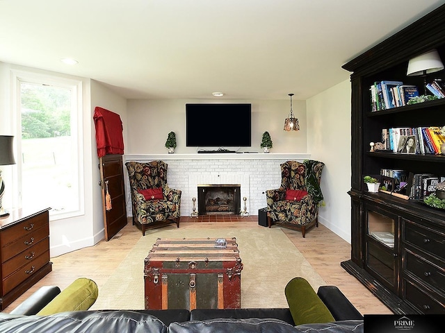 20640 Rawhide Rd, Omaha, NE 68022 - living area with wood finished floors, baseboards, a fireplace, and recessed lighting