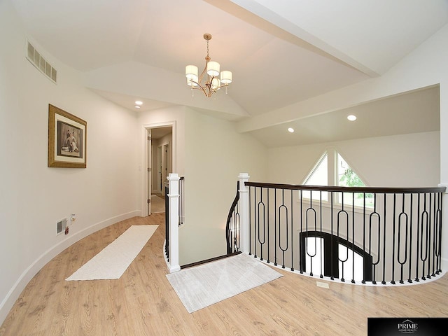 20640 Rawhide Rd, Omaha, NE 68022 - corridor featuring lofted ceiling, an upstairs landing, a chandelier, wood finished floors, and baseboards