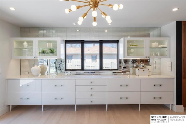 1312 S 78th St, Omaha, NE 68124 - bar with tasteful backsplash, recessed lighting, and light wood-type flooring