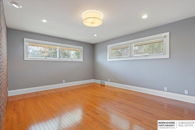 1312 S 78th St, Omaha, NE 68124 - unfurnished room with light wood finished floors, baseboards, and recessed lighting