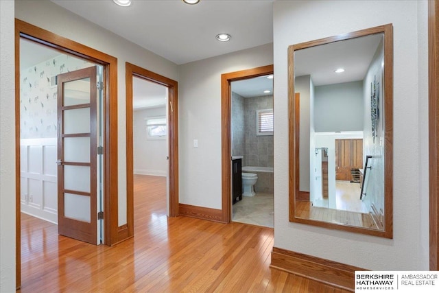 1312 S 78th St, Omaha, NE 68124 - hall featuring wood finished floors, plenty of natural light, baseboards, and recessed lighting