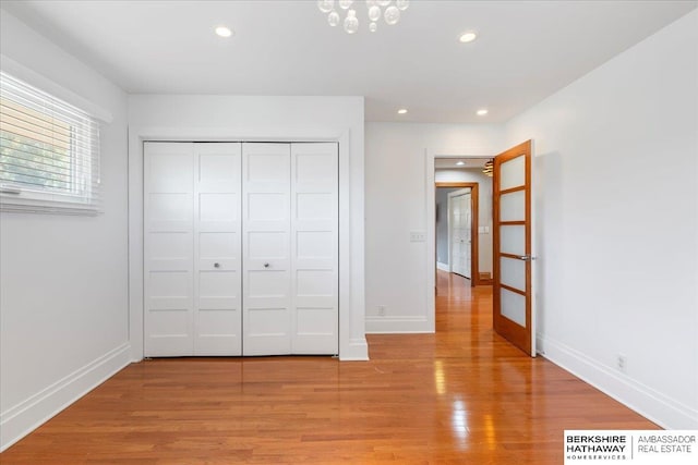 1312 S 78th St, Omaha, NE 68124 - unfurnished bedroom featuring baseboards, light wood-type flooring, recessed lighting, and a closet
