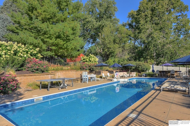 1312 S 78th St, Omaha, NE 68124 - view of swimming pool featuring a patio area and view of scattered trees