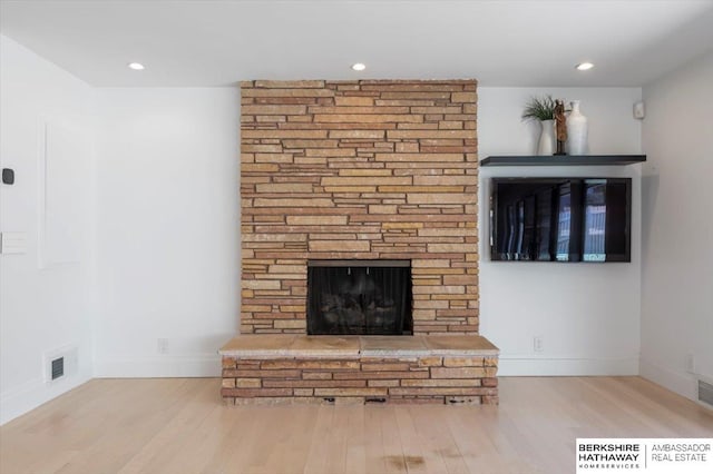 1312 S 78th St, Omaha, NE 68124 - detailed view of wood finished floors, a fireplace, baseboards, and recessed lighting