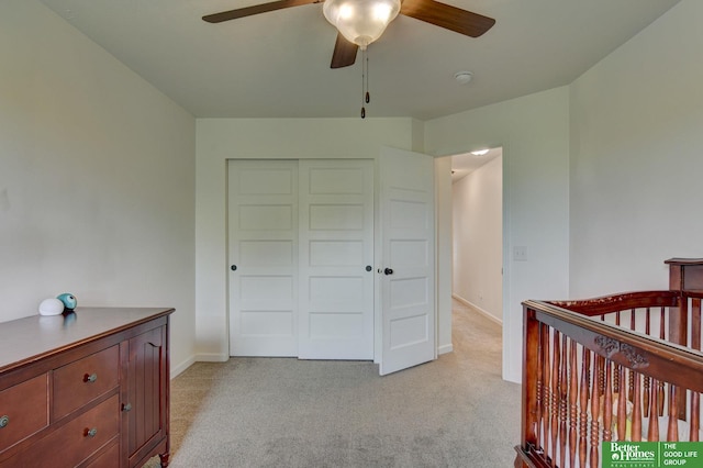 10505 Rosewater Pkwy, Bennington, NE 68007 - bedroom featuring light carpet, baseboards, a closet, and a ceiling fan