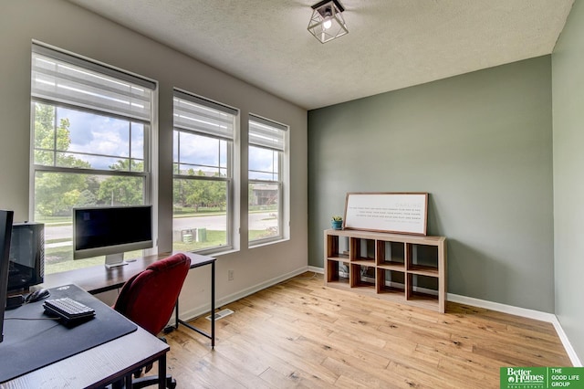 10505 Rosewater Pkwy, Bennington, NE 68007 - office area with wood finished floors, a textured ceiling, and baseboards