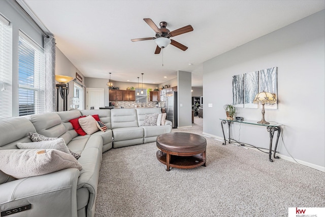 21327 Quarry Ln, Gretna, NE 68028 - living room with ceiling fan, baseboards, and light carpet