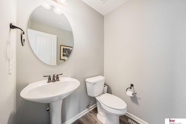 21327 Quarry Ln, Gretna, NE 68028 - half bath with wood finished floors, toilet, and baseboards
