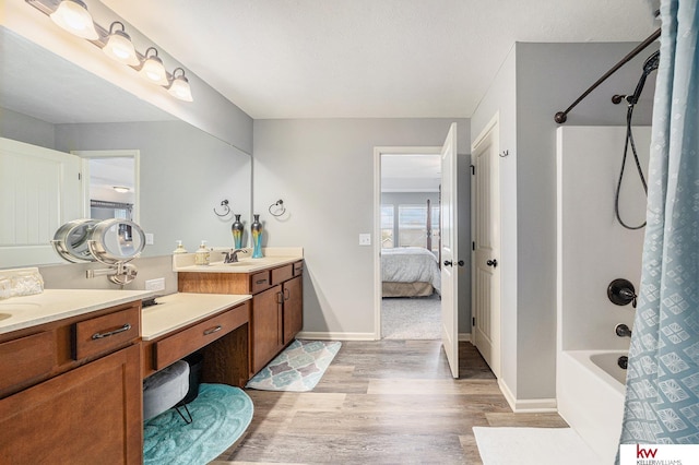 21327 Quarry Ln, Gretna, NE 68028 - ensuite bathroom with wood finished floors, vanity, shower / tub combo with curtain, and baseboards