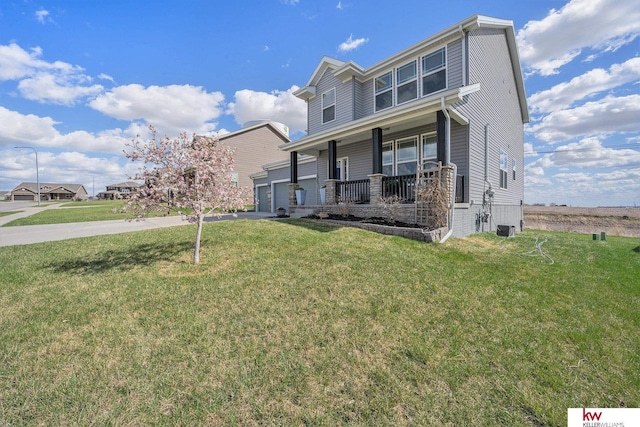 21327 Quarry Ln, Gretna, NE 68028 - view of front of house with a porch, a front yard, driveway, and an attached garage