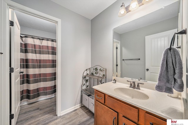 21327 Quarry Ln, Gretna, NE 68028 - bathroom with vanity, wood finished floors, baseboards, and a shower with curtain