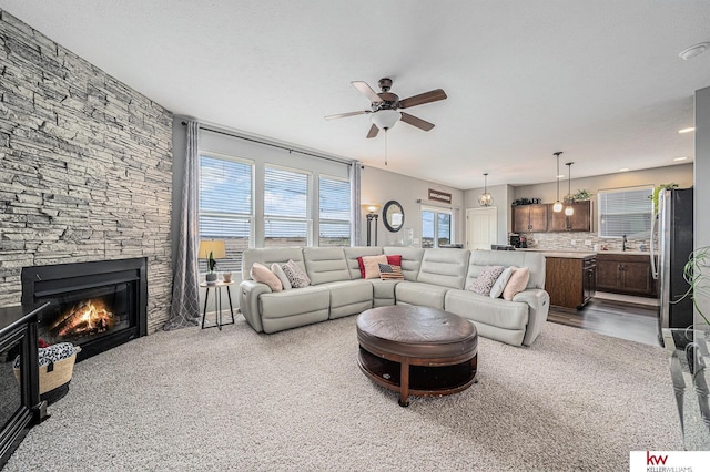 21327 Quarry Ln, Gretna, NE 68028 - living room with ceiling fan, a fireplace, and carpet