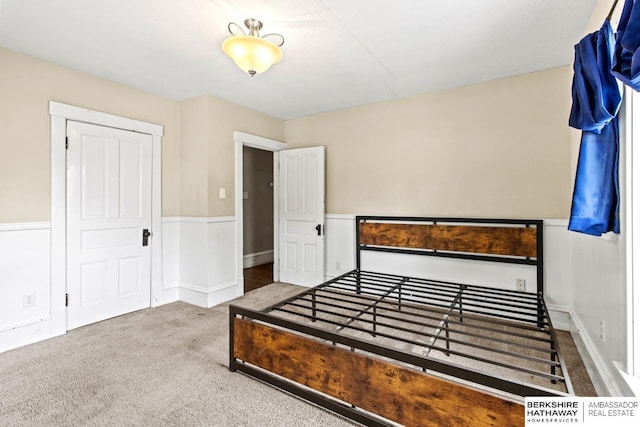 646 W 8th St, Fremont, NE 68025 - unfurnished bedroom with carpet floors and a wainscoted wall