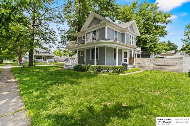 646 W 8th St, Fremont, NE 68025 - victorian home featuring a porch