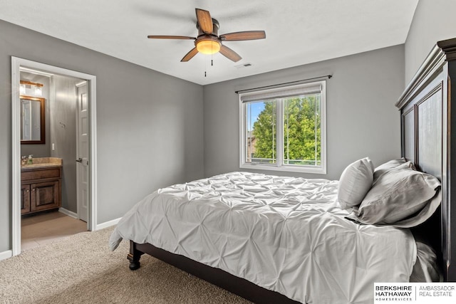 1220 S 200th Ave, Omaha, NE 68130 - bedroom featuring carpet flooring, baseboards, connected bathroom, and a ceiling fan