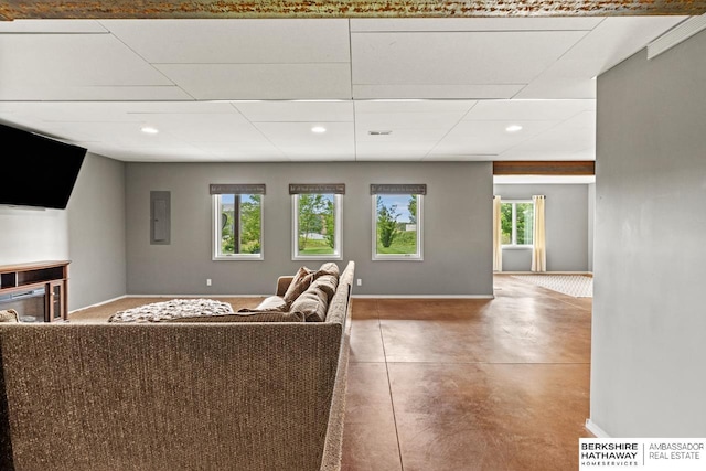 1220 S 200th Ave, Omaha, NE 68130 - living room with plenty of natural light, recessed lighting, concrete floors, baseboards, and electric panel